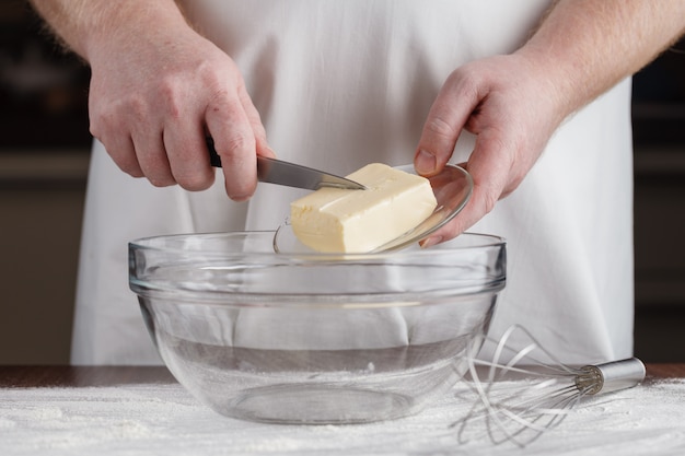 Baking: Hand Cuts Into Butter With Ingredients to Make Muffins Scattered Around Counter