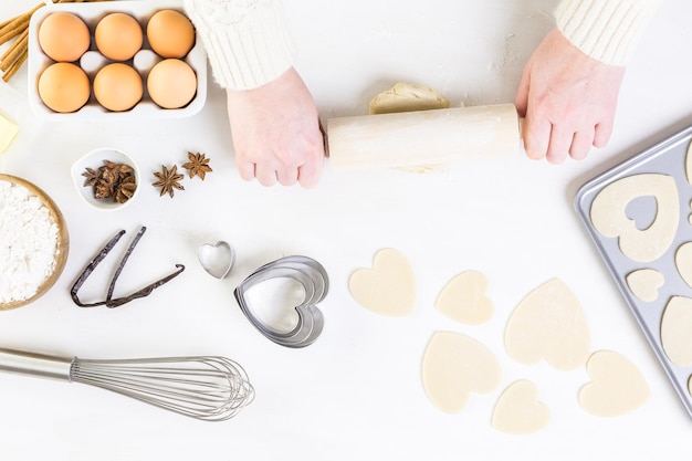 Baking heart shaped sugar cookies for Valentines Day.