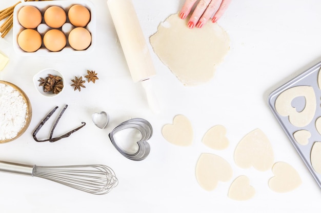 Baking heart shaped sugar cookies for Valentines Day.