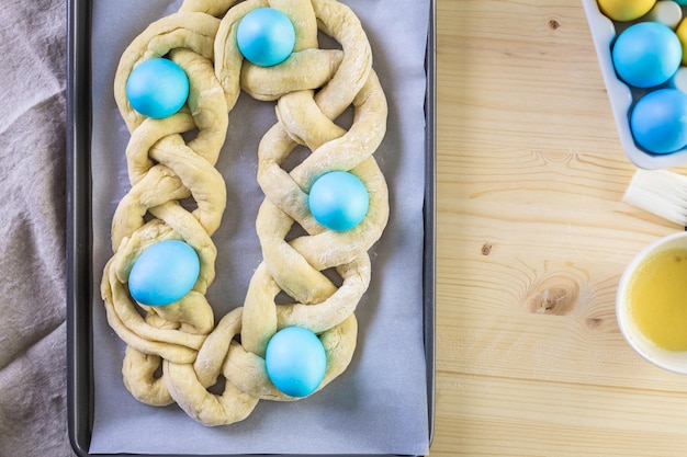 Baking home made Italian Easter bread with organic blue eggs.