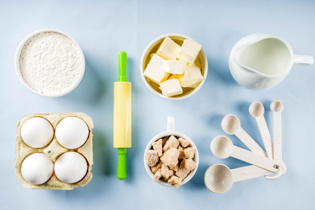 Baking ingredients on blue background