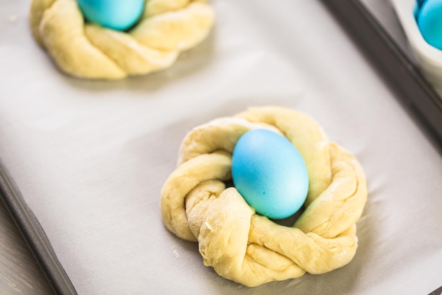 Baking Italian Easter bread with blue colored egg.