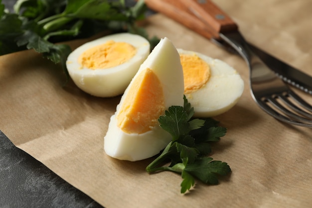 Baking paper with boiled eggs, parsley and forks