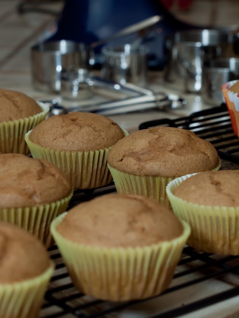 Baking pumpkin cupcakes for party.