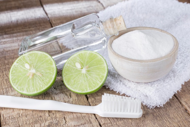 Baking soda and lemon on wooden table