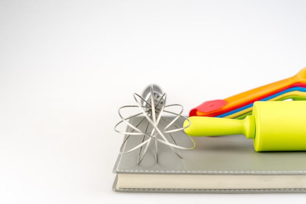 Baking tools and different shapes on white background 