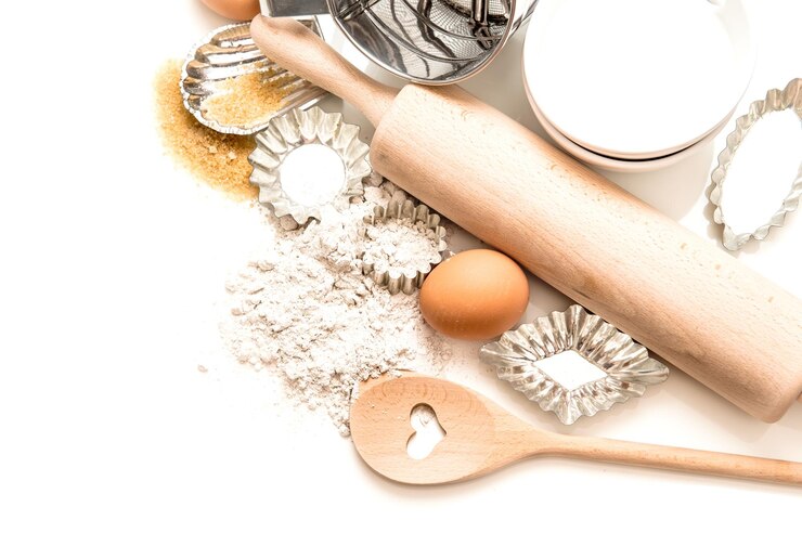 Photo baking tools and ingredients flour eggs sugar rolling pin