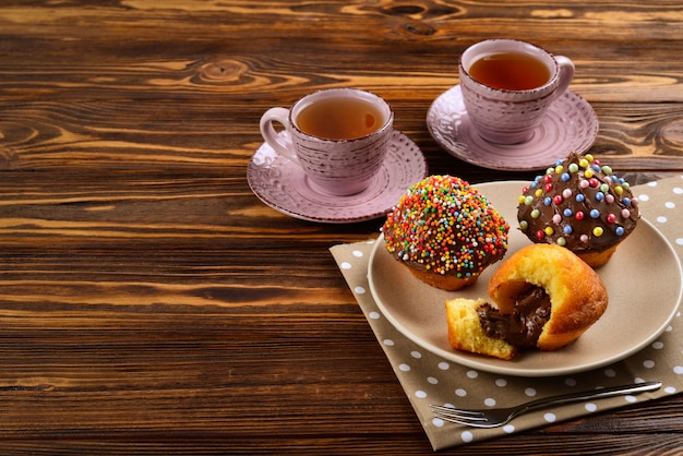 Baking with tea and chocolate on the table.