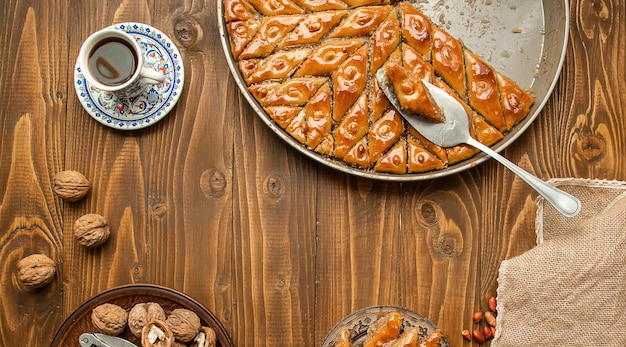 Baklava with nuts on a wooden background Selective focus