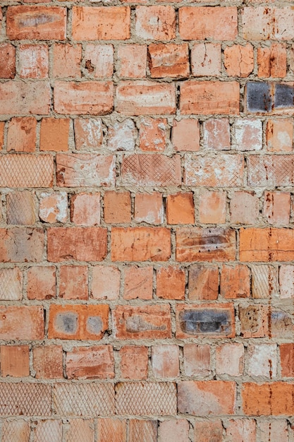 Bakstenen muur oranje achtergrond