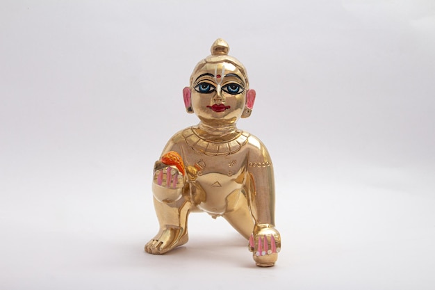 Bal krishna laddu gopal messing standbeeld voorzijde naar witte achtergrond