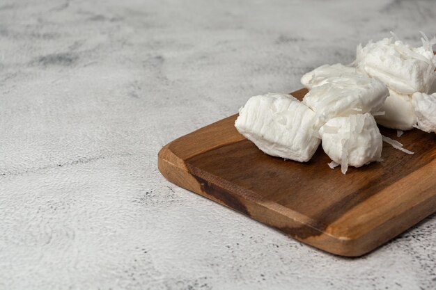 bala de coco, or coconut candy. a traditional brazilian sweet