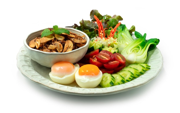 Balachaung Chilli Shrimps dried Paste Burmese Style served Vegetables And Boiled Eggs sideview