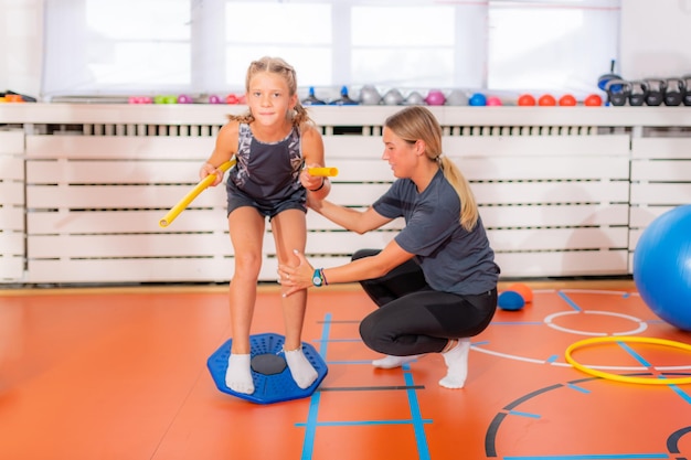 Balance exercises for children using balancing disks