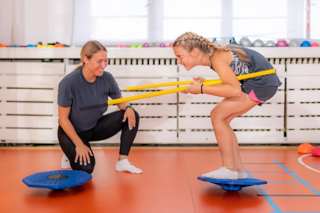 Balance exercises for children using balancing disks