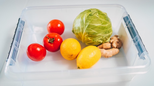 Balanced diet cooking culinary and food concept close up of vegetables and citrus on glass plate Healthy food concept