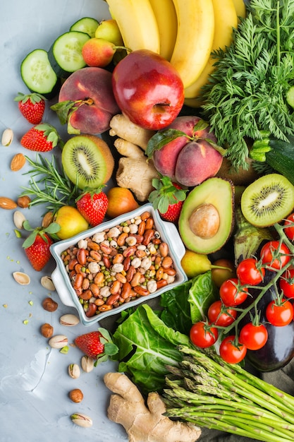 Balanced nutrition concept for clean eating alkaline diet. Assortment of healthy food ingredients for cooking on a kitchen table. Top view flat lay background