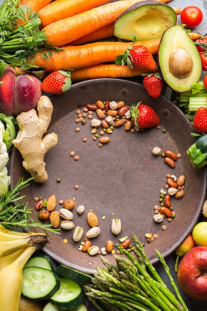 Balanced nutrition concept for clean eating alkaline diet. Assortment of healthy food ingredients for cooking on a kitchen table. Top view flat lay background