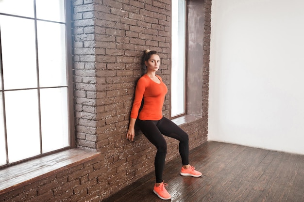 Balancing exercise activity woman looking at camera and doing workout