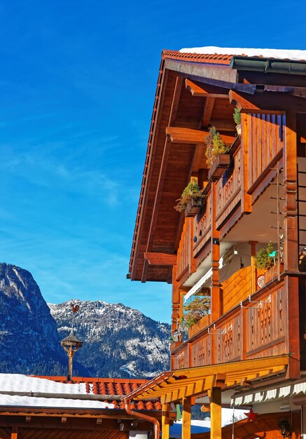 Balcony in Bavarian style and Alps in winter Garmisch Partenkirchen, Germany.