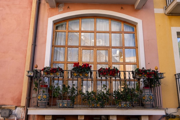 A balcony with a window and a railing