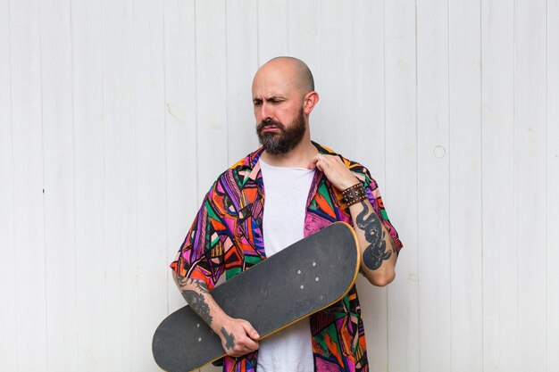 Bald man feeling stressed, anxious, tired and frustrated, pulling shirt neck, looking frustrated with problem