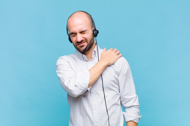 Bald man feeling tired