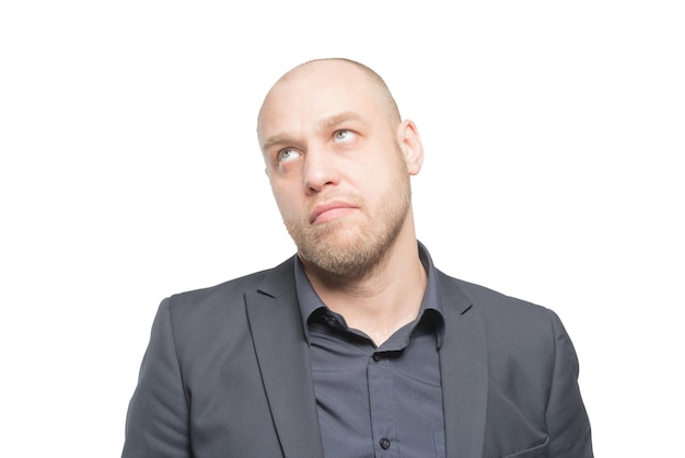 Bald man in a gray suit looking up Isolated