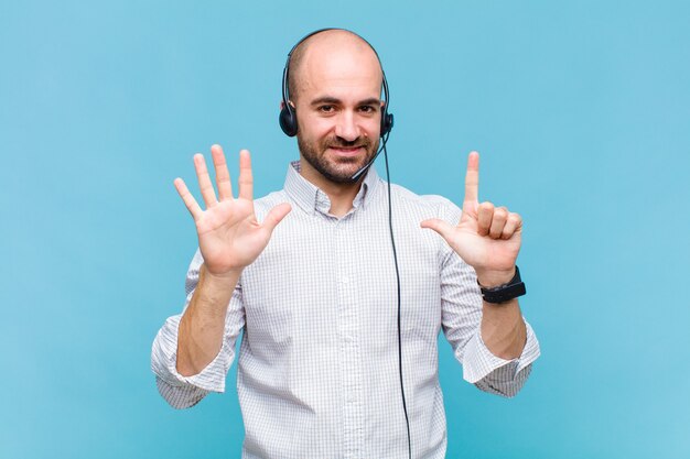 Bald man smiling and looking friendly