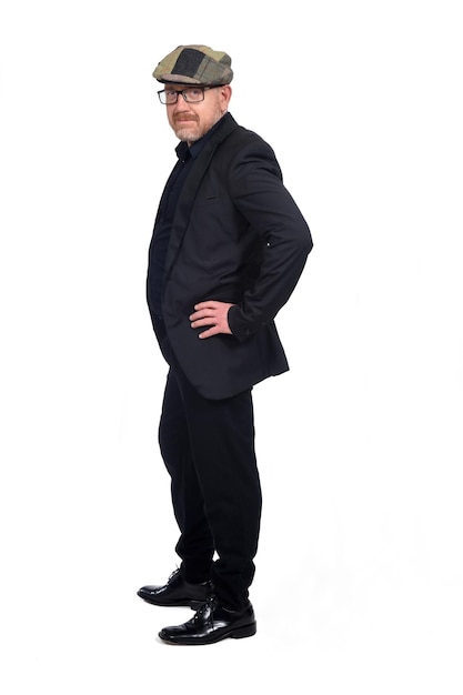 bald man with glasses and cap on white background,looking at camera