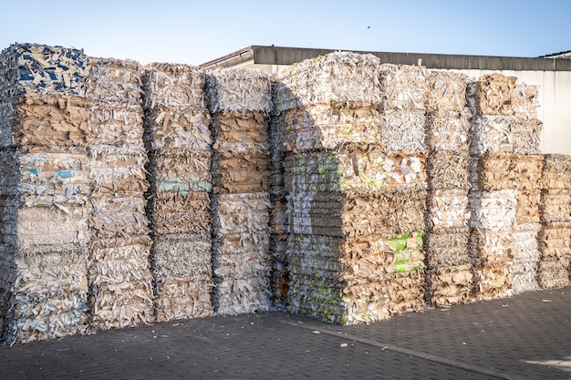 Bales of cardboard and box board with strapping wire ties recycling