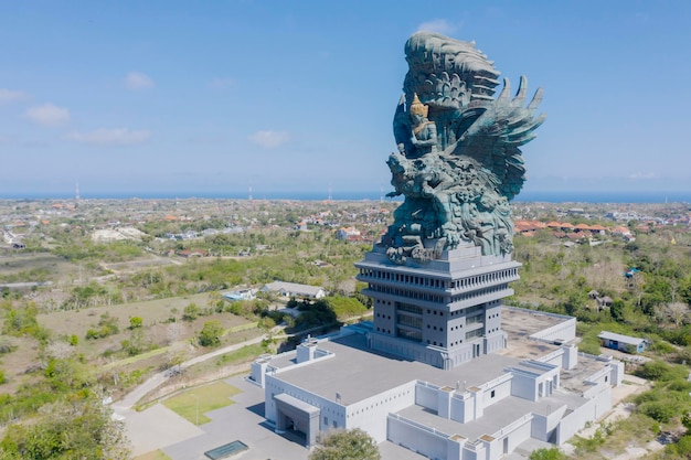 Bali Indonesia November 12 2020 Aerial view of Garuda Wisnu Kencana GWK statue under blue sky in Bali Indonesia