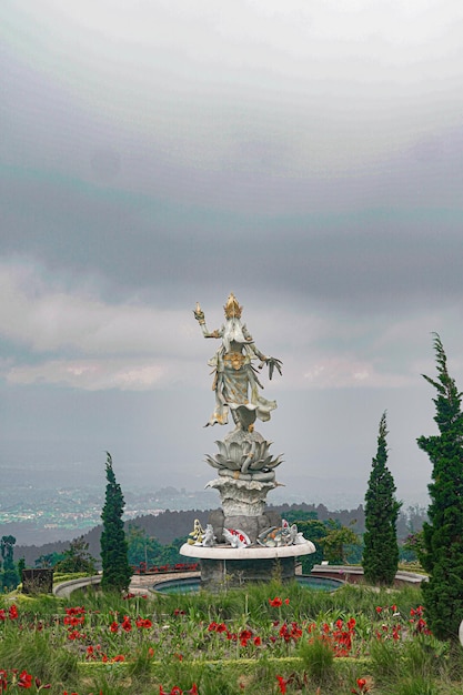 balinese goddess statue in garden premium photo