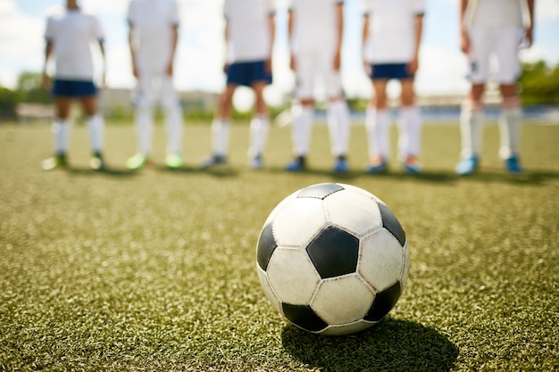 Ball on Grass in Junior Football Match