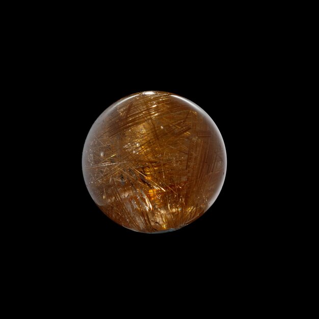 Ball of quartz with rutile on a black background