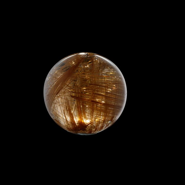 Ball of quartz with rutile on a black background