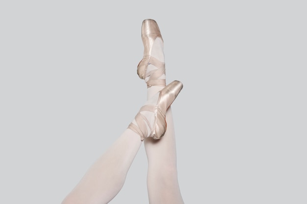 Ballerina legs in light classic pointe shoes