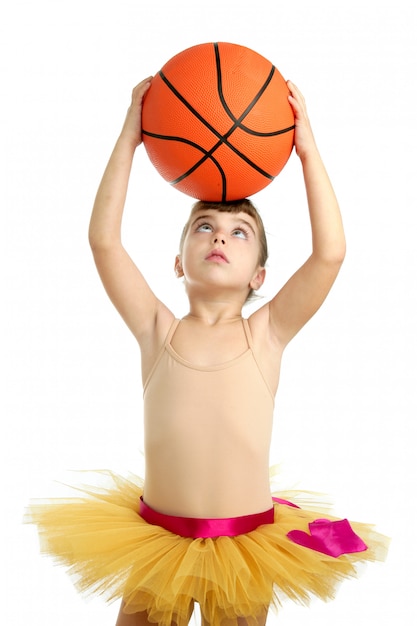 Ballerina little girl with basketball ball