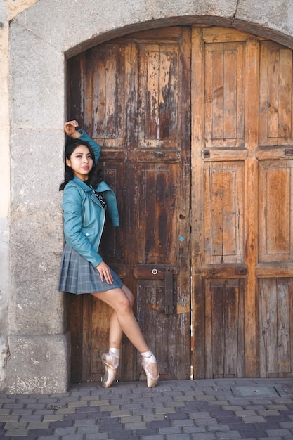 ballet dancer in street wearing skirt and jacket