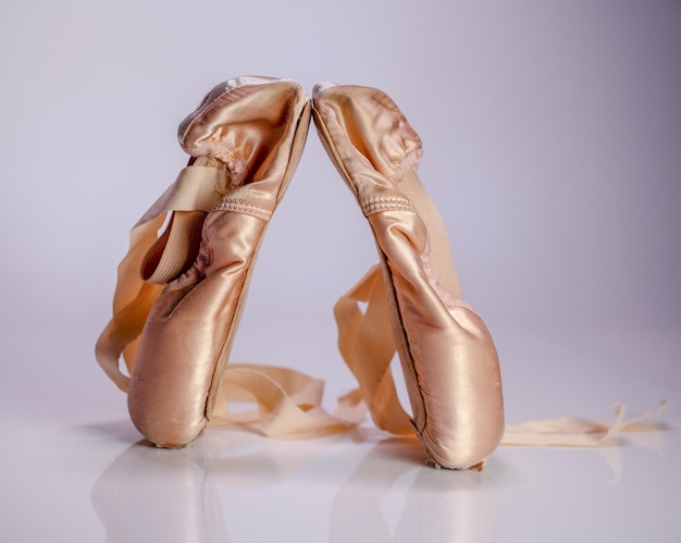 Photo ballet shoes over white background