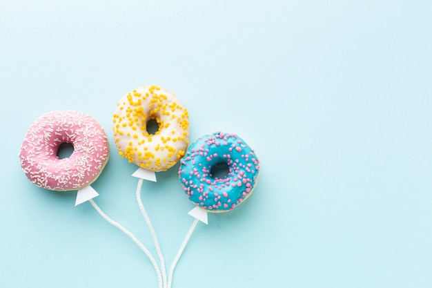 Photo balloon concept with donuts copy space