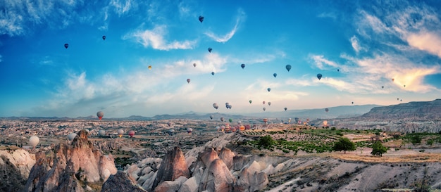 Balloons in the cloudy sky over Cappadocia