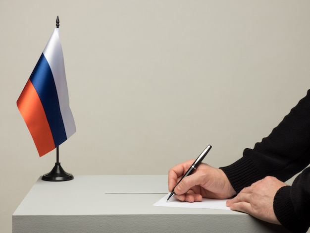 Ballot box with national flag of Russia. Presidential election in 2018. hand throwing a ballot