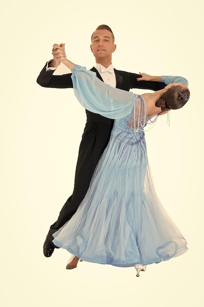 Ballrom dance couple in a dance pose isolated on black background