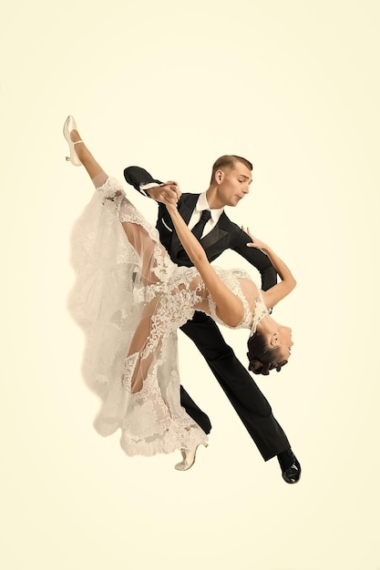 Ballrom dance couple in a dance pose isolated on white bachground