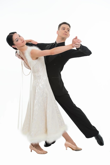 Ballroom dance couple in a dance pose isolated on white background. ballroom sensual proffessional dancers dancing walz, tango slow fox. ballroom couple dance professional