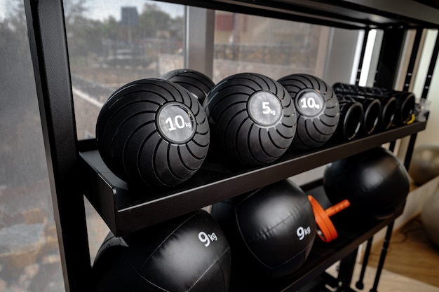 Balls and foam roller sport equipment in a gym