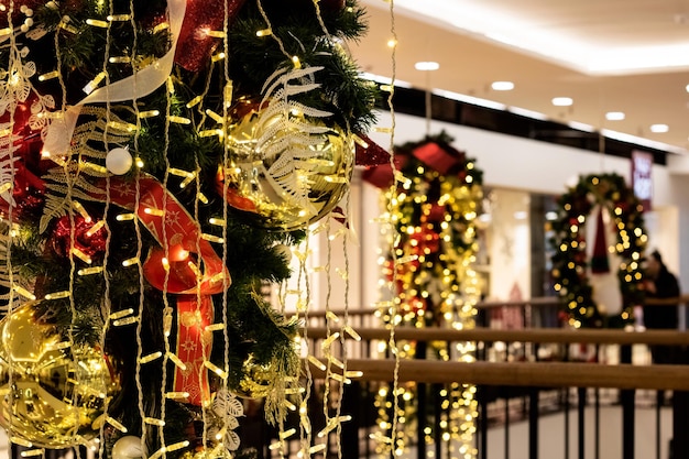 Balls and ribbons on Christmas tree festive decoration