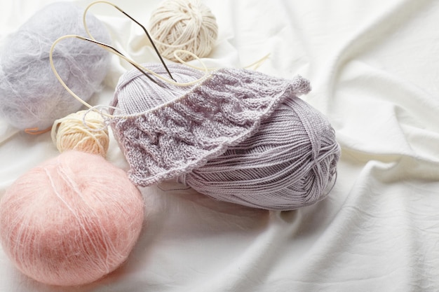 Balls of wool and mohair for knitting in pastel colors