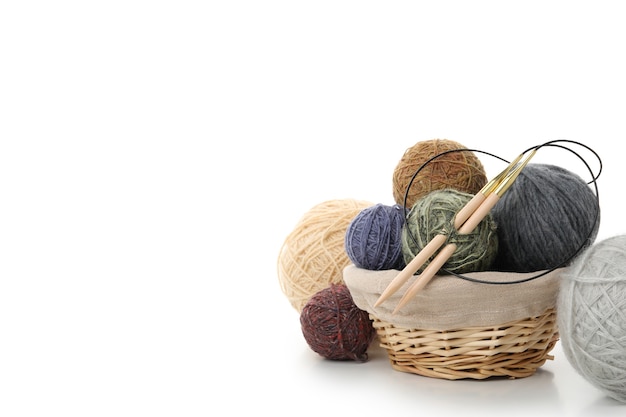 Knitting supplies close-up. Balls of knitting wool in a round wicker basket  Stock Photo - Alamy